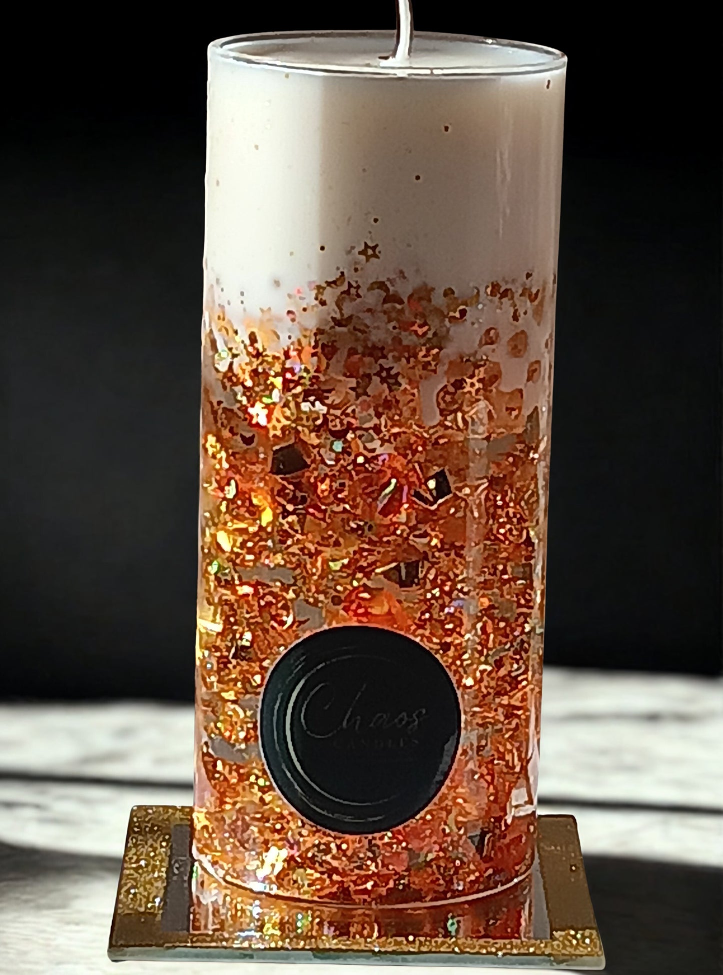 Gold Pillar luxury soy candle sealed in a glass cylinder with amber glitter and pearls – hand-poured by Chaos Candles in California