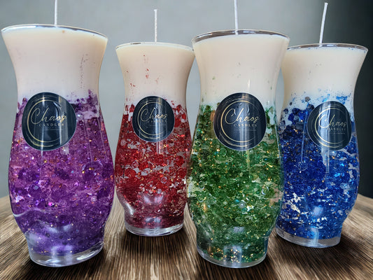 Luxury décor candles by Chaos Candles featuring colorful gemstone-inspired bases and handcrafted artistic designs.