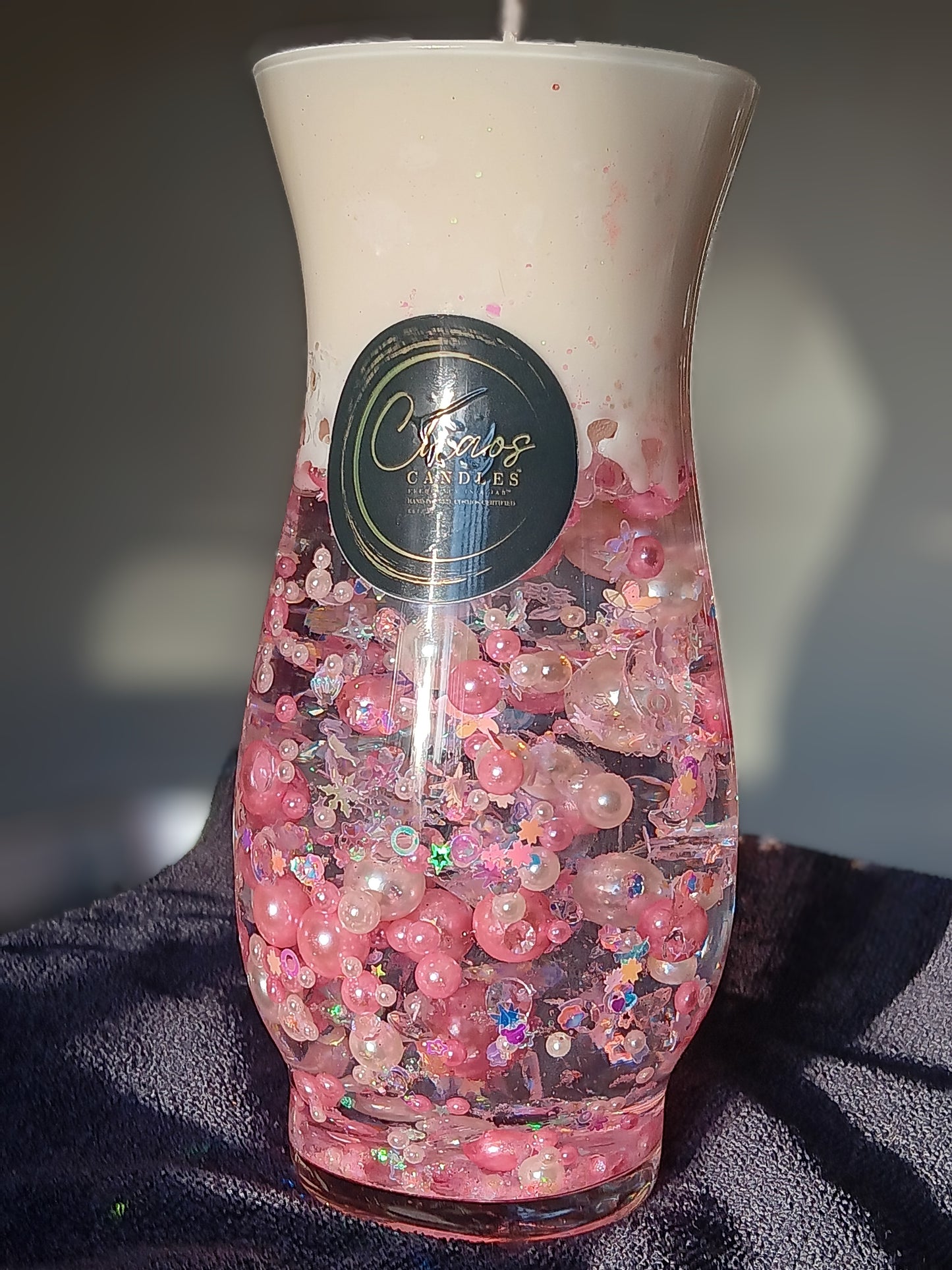 Curved vase decor candle with suspended blush and pearl beads  with soy wax.