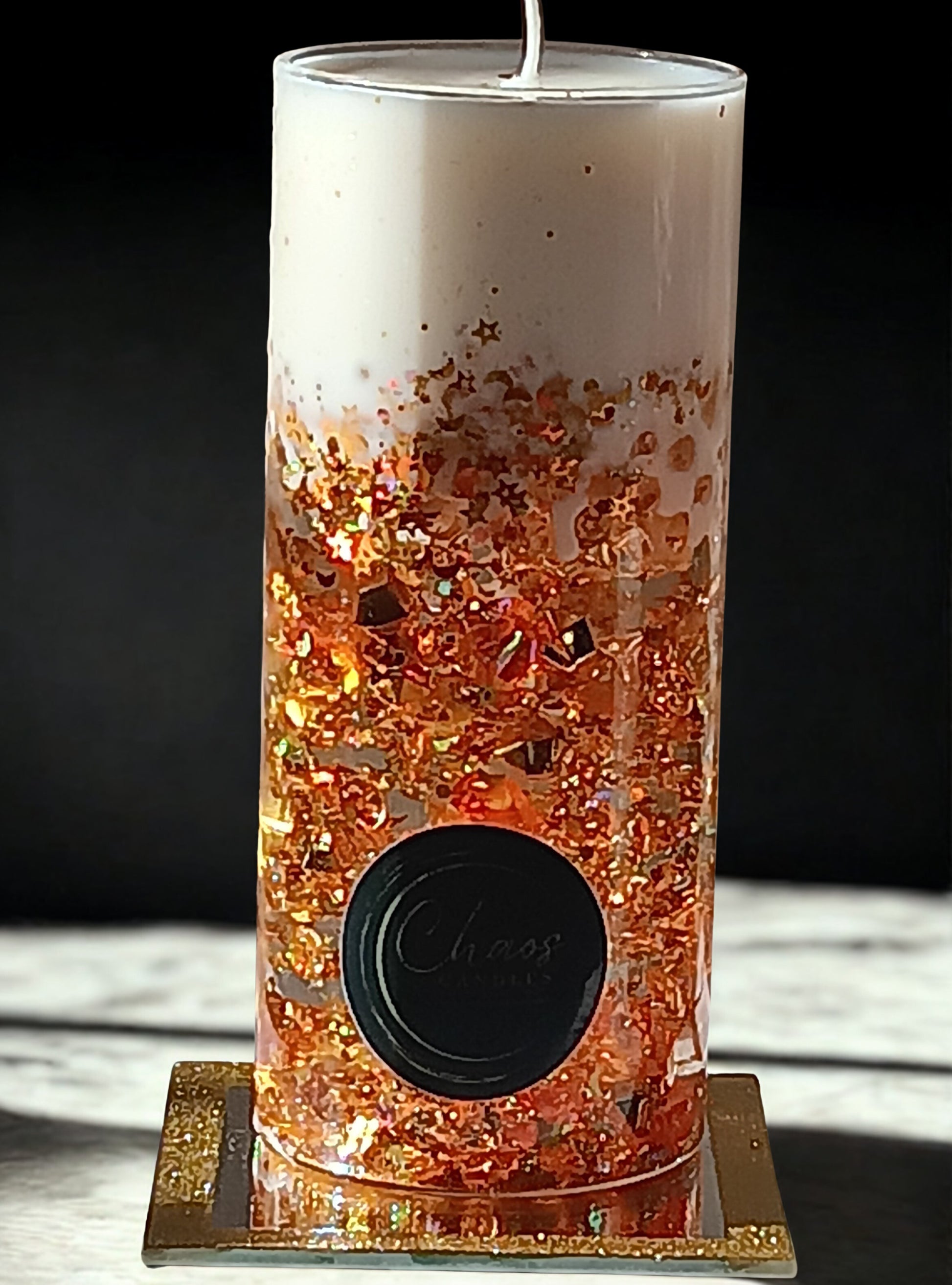 Gold Pillar luxury soy candle sealed in a glass cylinder with amber glitter and pearls – hand-poured by Chaos Candles in California